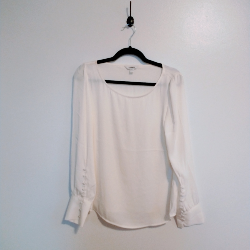 Express white blouse with balloon sleeves and buttons at the cuffs.  Size small.